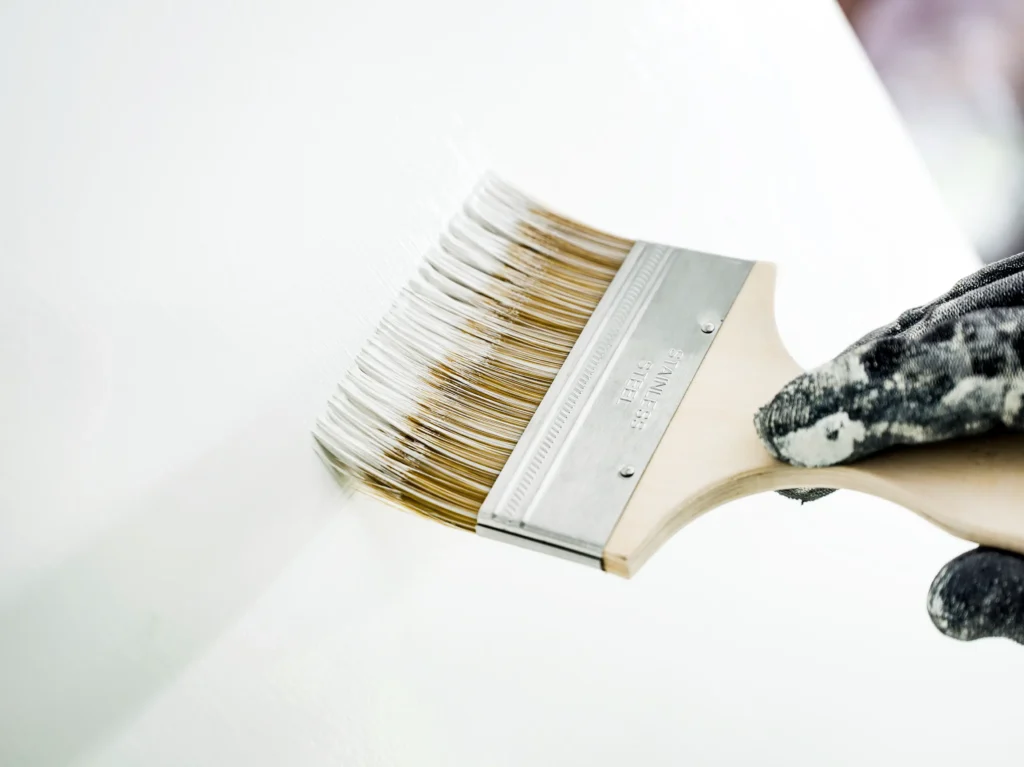 Professional-grade paintbrush used by a painting company for interior work.